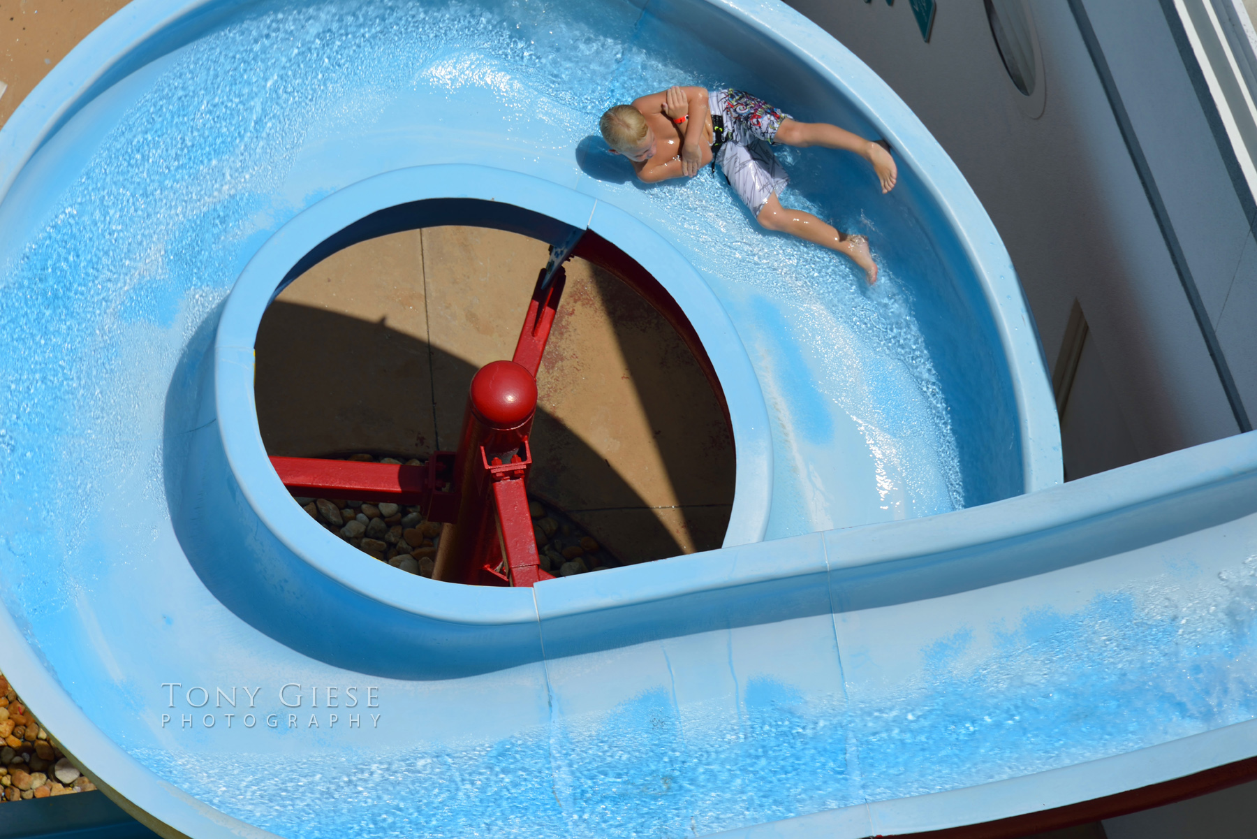 Kids love water sliding on hot day Wyndham Ocean Walk Resort, Daytona Beach, Florida. Photography by Tony Giese