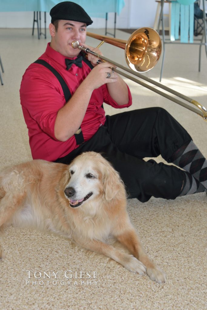 Band member playing jazz to 16 year old Golden Retriever.