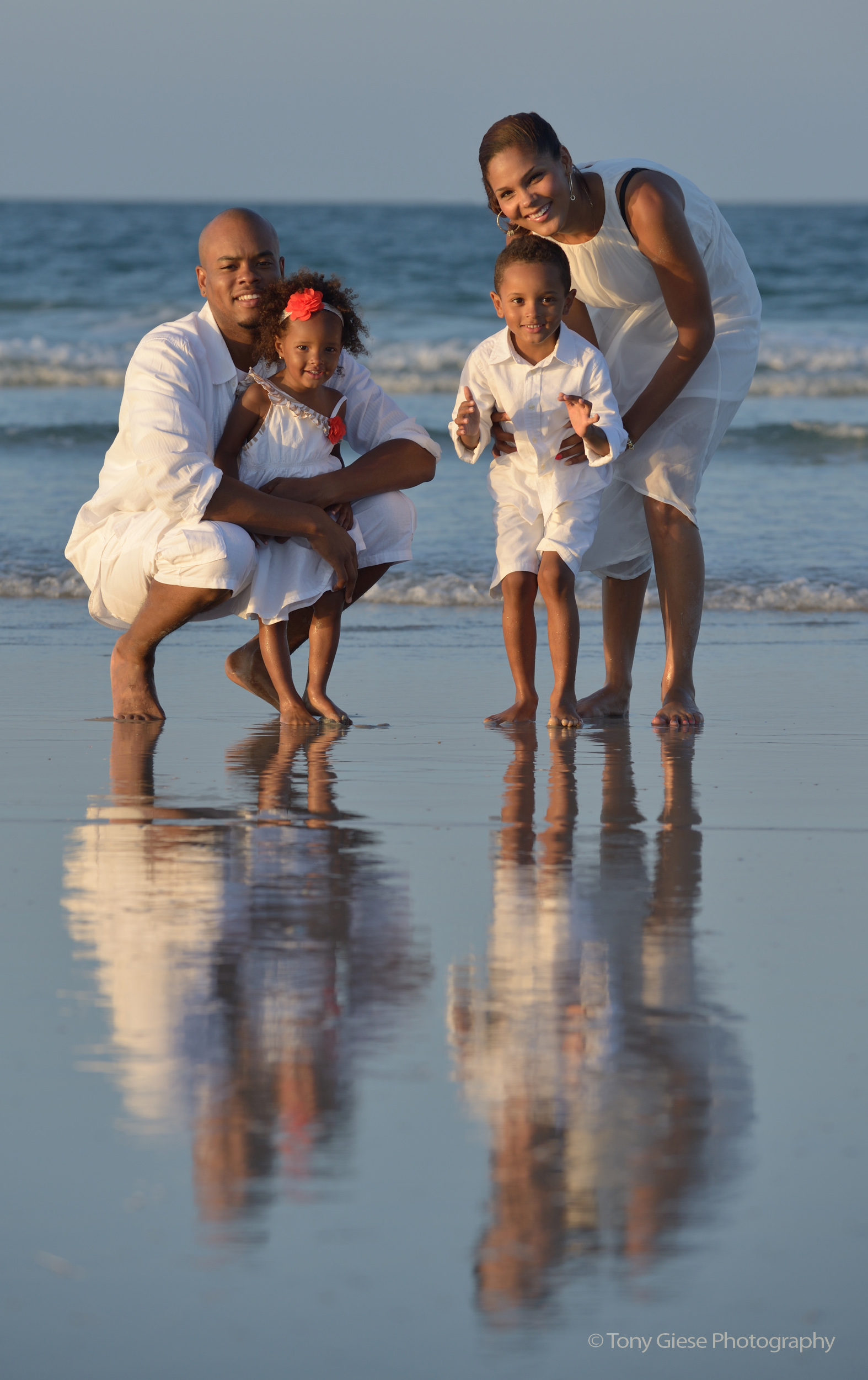 Family beach portrait by photographer Tony Giese. 