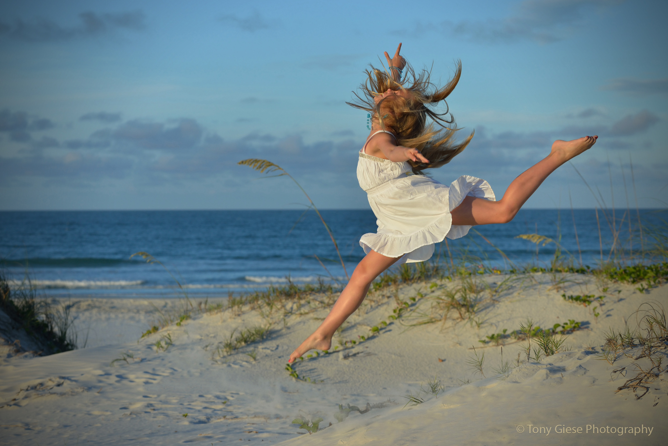 The joy of beautiful dance on Ponce Inlet beach, Florida.
