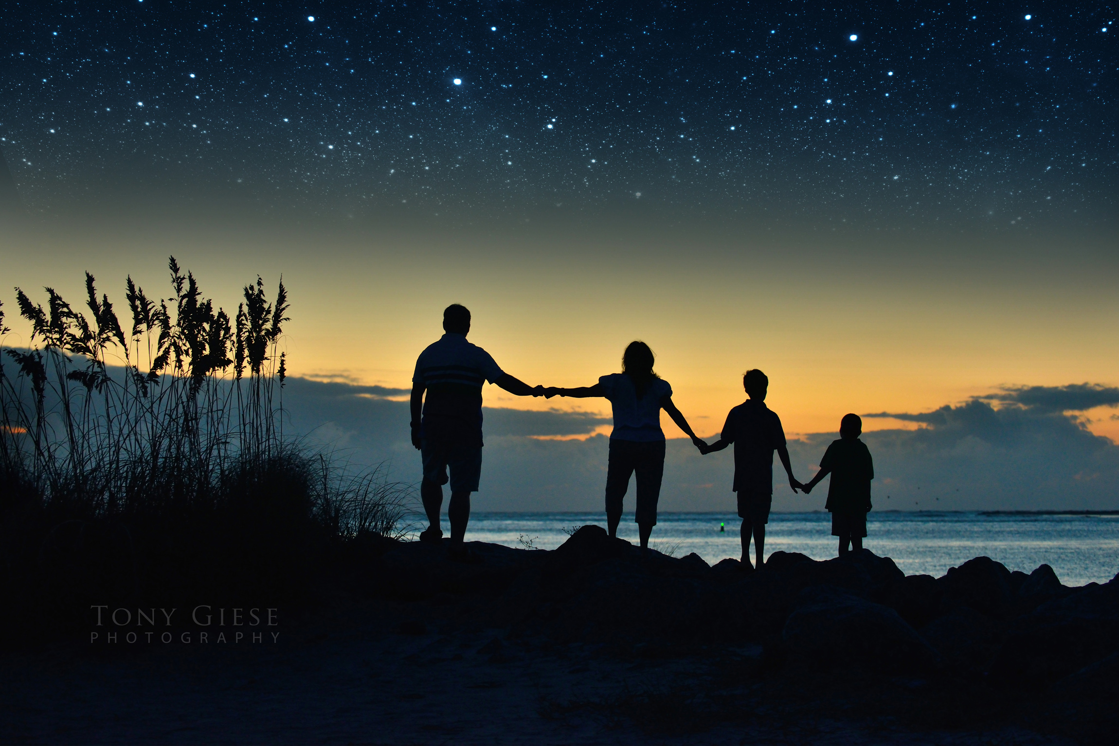 Pre dawn family portrait at Lighthouse Point Park, Florida.