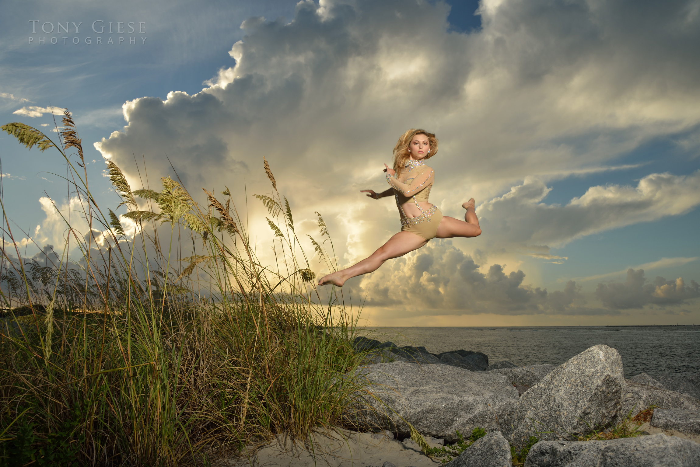 Tallee dancing move of jumping rocks on ocean, Ponce Inlet, Florida. Photography by Tony Giese